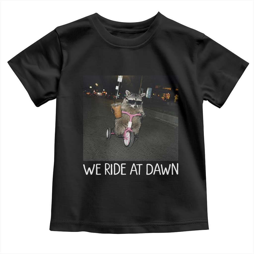 We Ride at Dawn Toddler T Shirt Funny Racoon Riding Tricycle Chaotic Meme