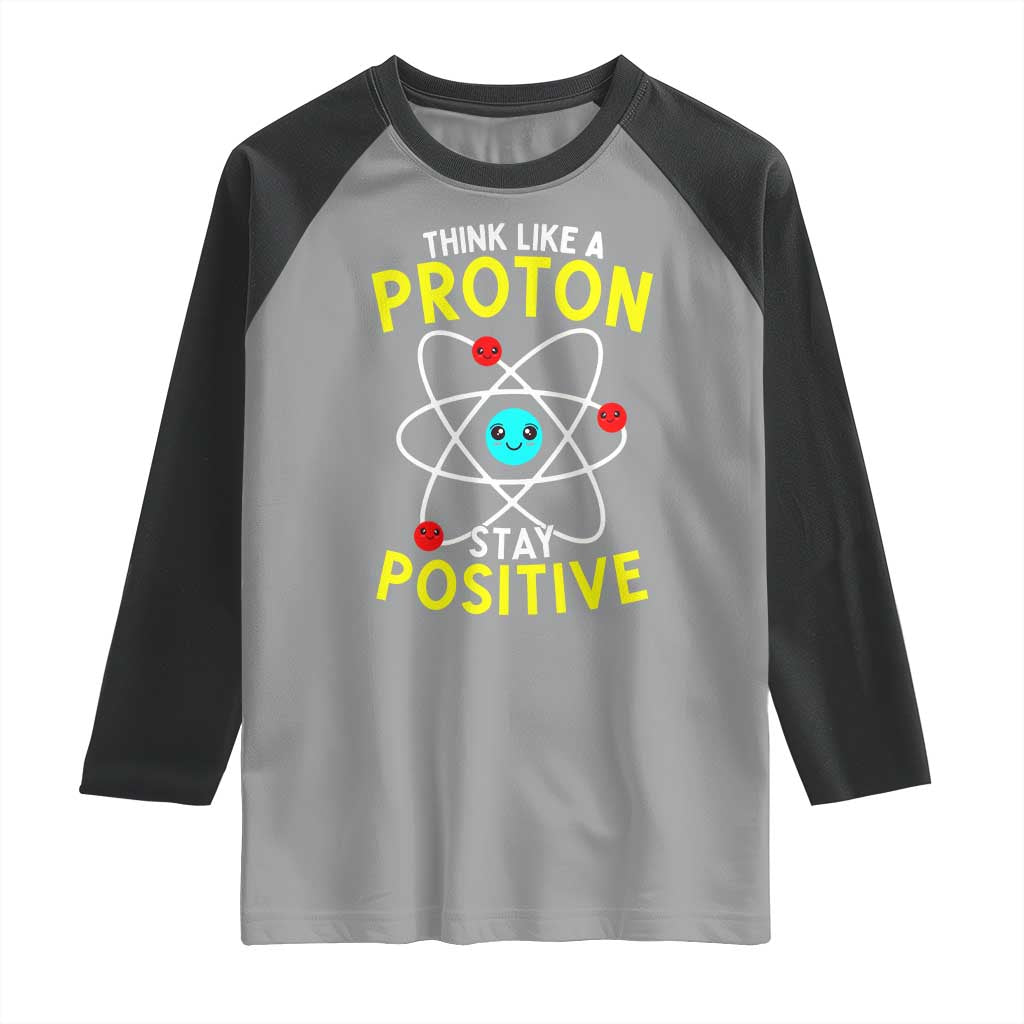 Think Like A Proton Stay Positive Raglan Shirt Funny Science - Wonder Print Shop