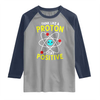 Think Like A Proton Stay Positive Raglan Shirt Funny Science - Wonder Print Shop