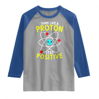 Think Like A Proton Stay Positive Raglan Shirt Funny Science - Wonder Print Shop