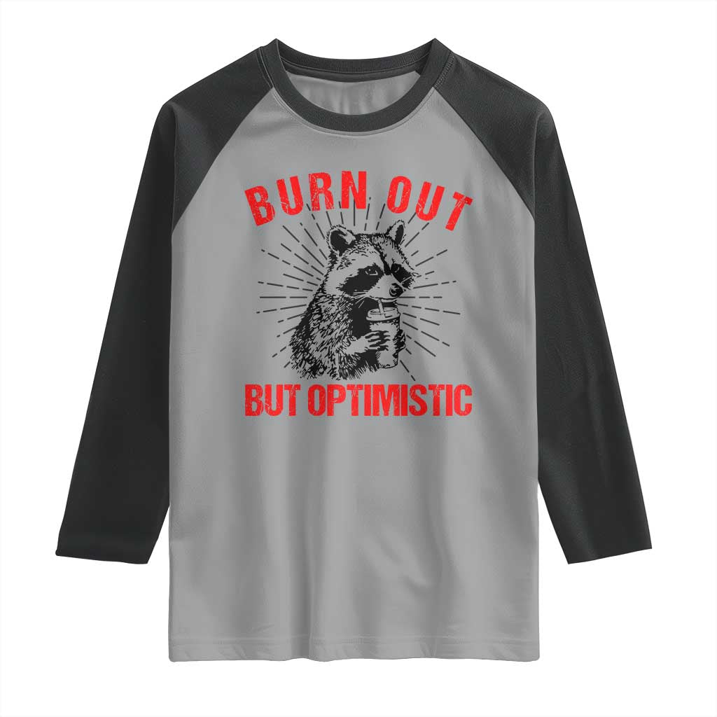 Burnt Out But Optimistic Raglan Shirt Funny Raccoon Meme - Wonder Print Shop