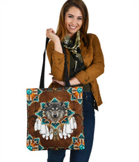 Brown Native tote bag with wolf medallion and turquoise geometric trim, black straps