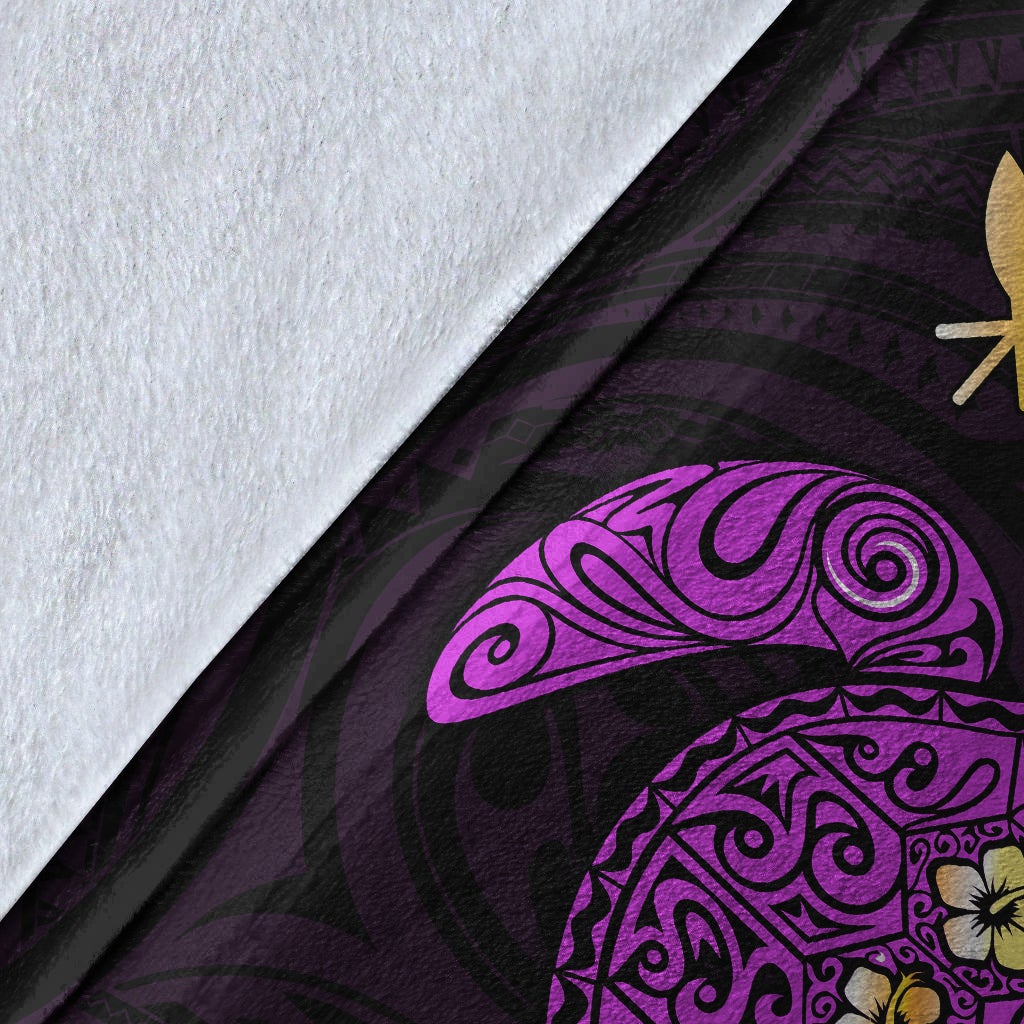 Purple Hawaiian blanket fabric close-up with swirling turtle mandala and floral accents
