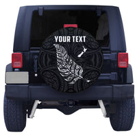 Black spare tire cover with ornate swirls, white fern, and 'YOUR TEXT' center