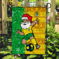 Green-and-yellow football flag with Santa and Brazil crest, featuring a soccer ball on a hook.