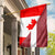 canada-flag-with-latvia-flag