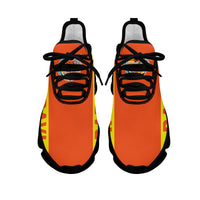 Clunky sneakers pair, orange upper with Baravi flag print, black laces, black sole