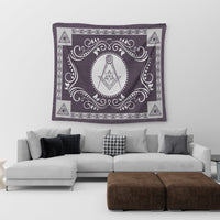 Purple tapestry with freemasonry crest in center and ornate scroll border, corner triangles