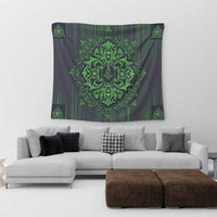 Rectangular tapestry on wall, dark with green ornate crest and small corner emblems