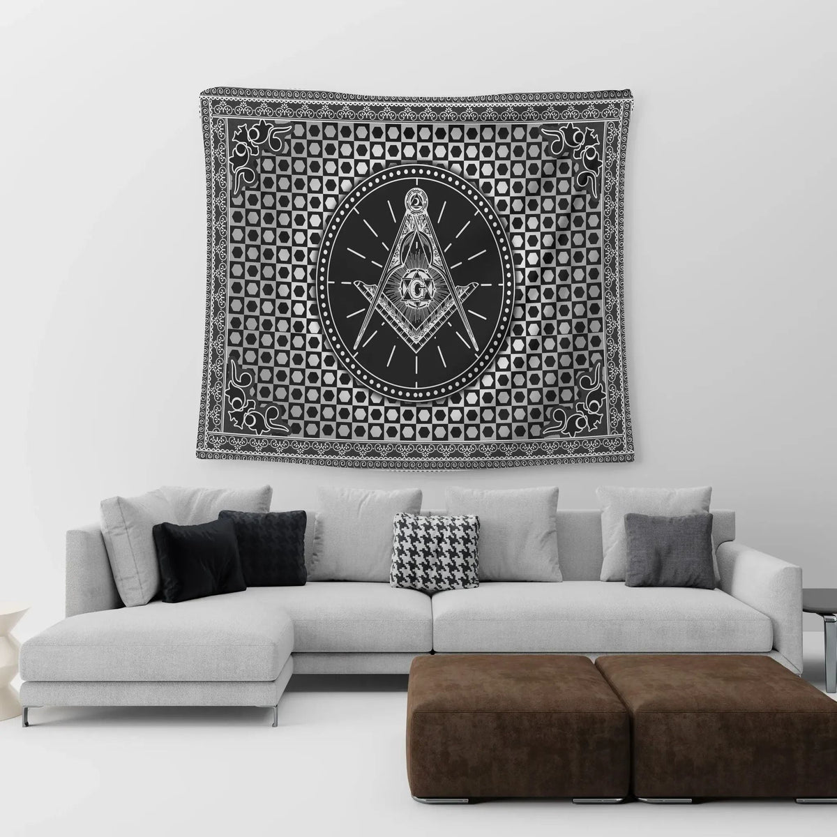 Black-and-white tapestry with square-and-compass Freemasonry crest in central circle