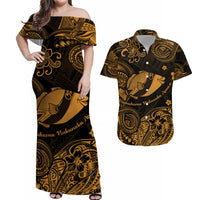Gold-and-black off-shoulder maxi dress with fish and tribal floral print