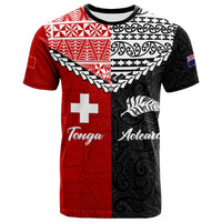 Red/black split T-shirt with Maori patterns, white cross, Tonga Aotearoa text, fish graphic