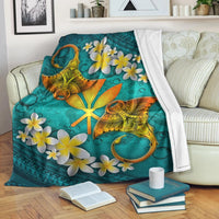 Turquoise Hawaiian manta ray blanket with yellow plumeria flowers and white border edge