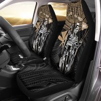 Black car seat covers with gold tribal Kamehameha warrior illustration on front seats