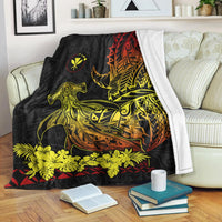 Black blanket with hammerhead shark print, yellow floral band, red and orange patterned shell