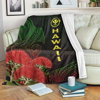Black Hawaii Polynesian blanket with green leaf patterns, red ohia blossoms, vertical “HAWAII” text