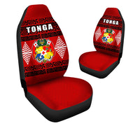 Pair of red Tonga car seat covers with black borders and crest emblem, TONGA on back