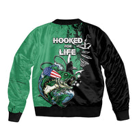Unisex bomber jacket in moss green and black with ribbed hem and back fish hook graphic
