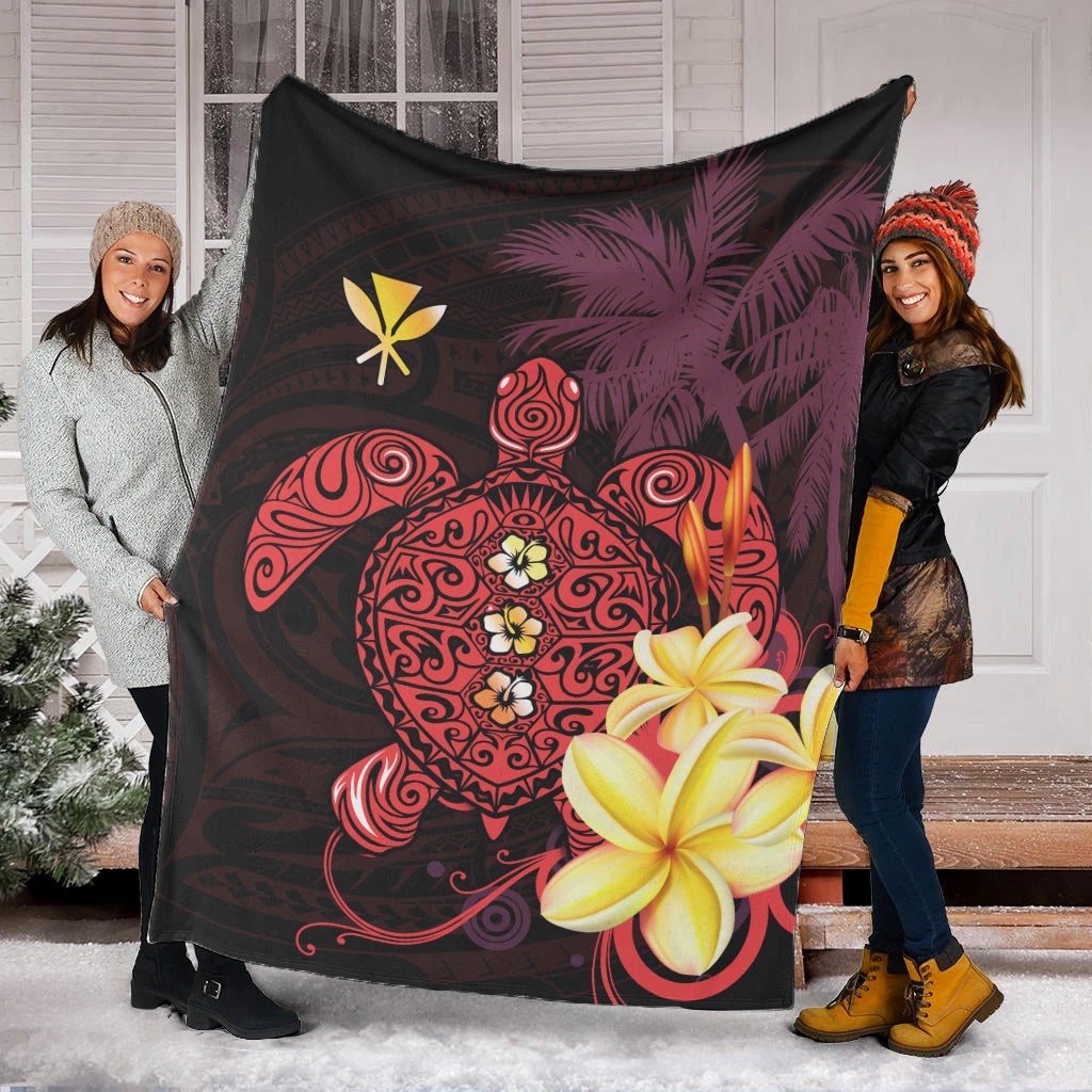 Hawaiian throw blanket featuring a turtle graphic, red swirls, and hibiscus flowers on dark fabric