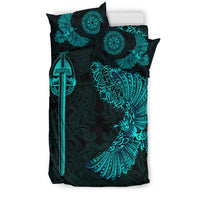 Black bedding set with teal raven wing and sword graphic, plus mandala medallion