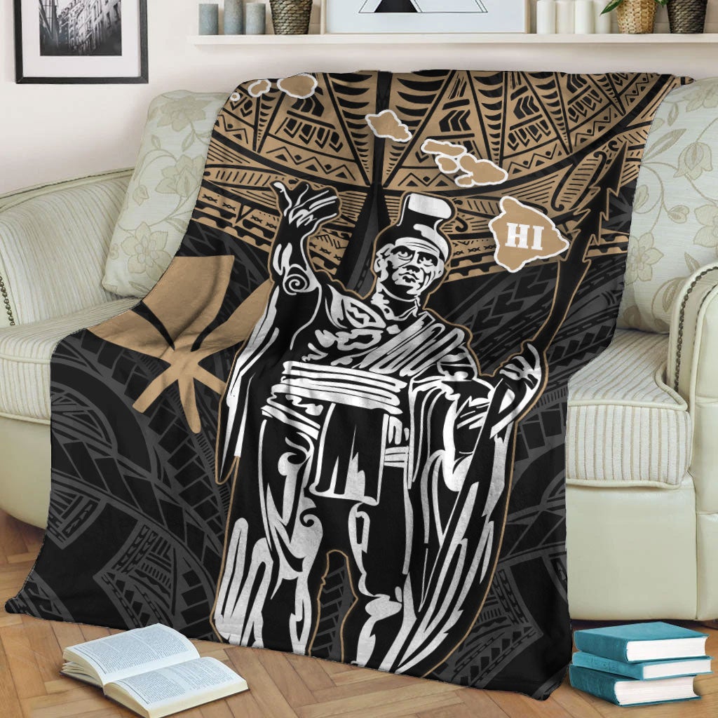 Black and gold tribal blanket with HI emblem and white king portrait, laid on couch