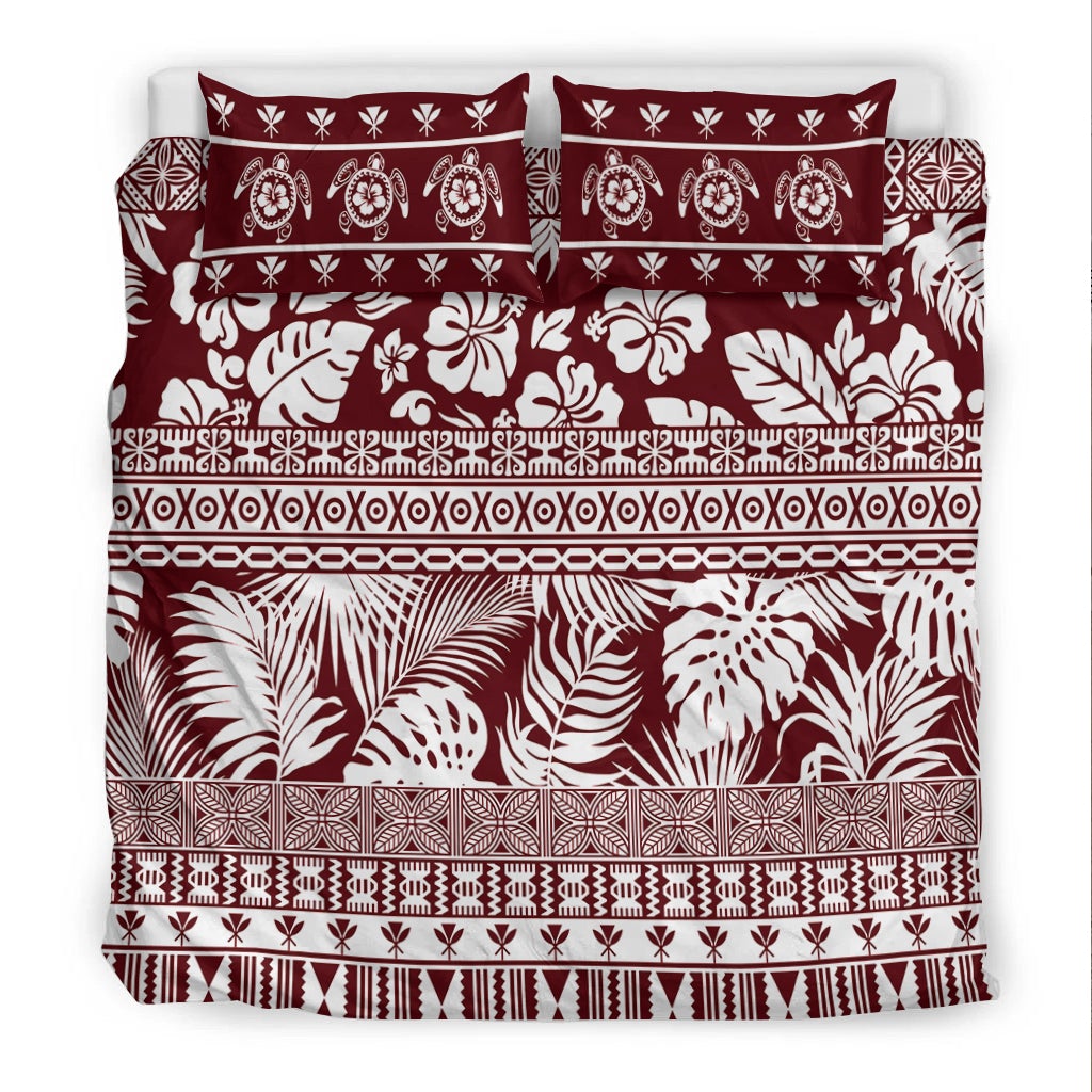 Red and white bedding set featuring bold leaf and floral prints with decorative stripe bands