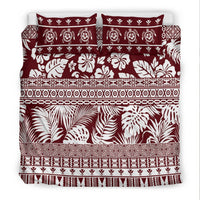 Red and white bedding set featuring bold leaf and floral prints with decorative stripe bands
