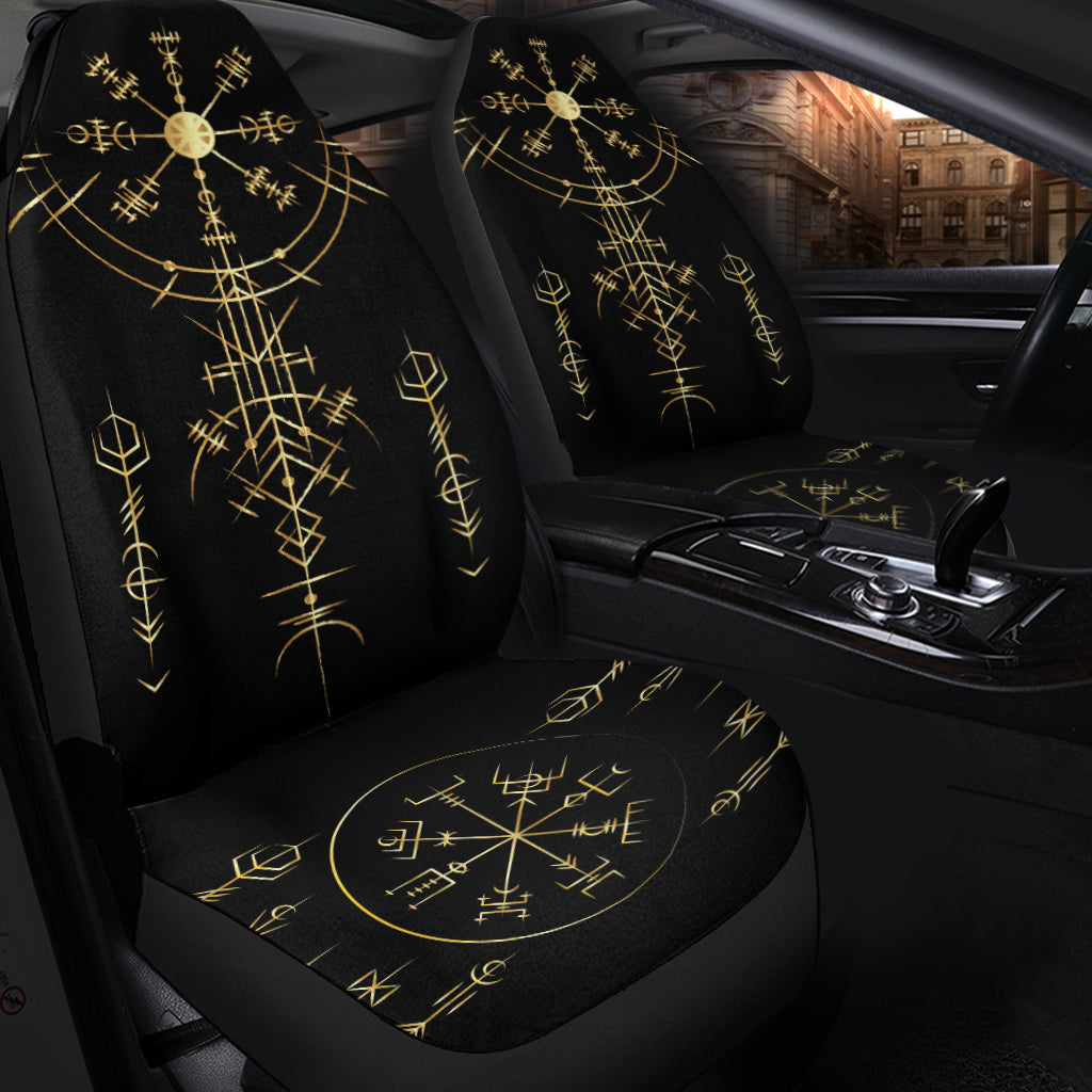 Front seats in black with gold helm-of-awe rune design on backrests and seat