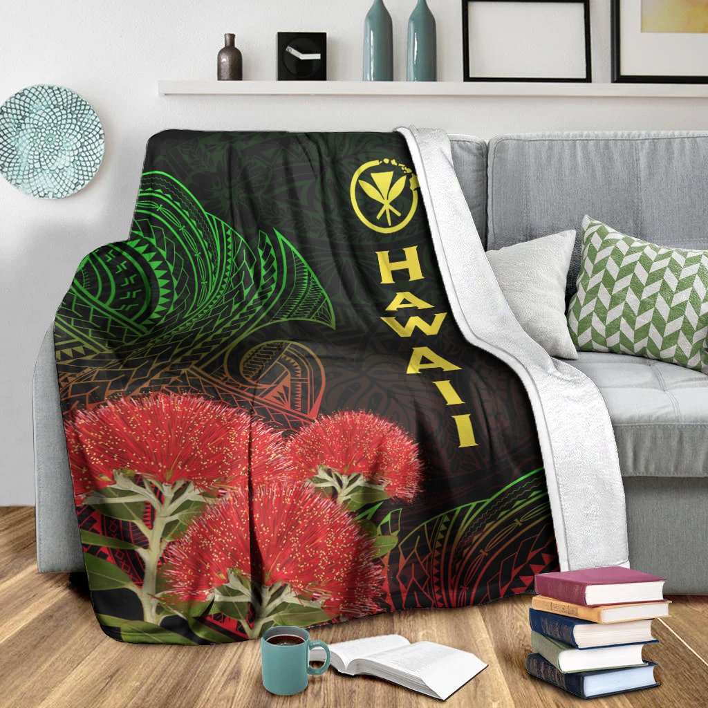 Black Hawaii Polynesian blanket showing green designs, red ohia blossoms, and yellow vertical “HAWAII”