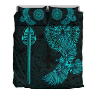 Black duvet cover with teal Viking sword, raven, and decorative fan-like feathers