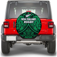 Spare tire cover, circular black fabric with green Maori rugby fern pattern