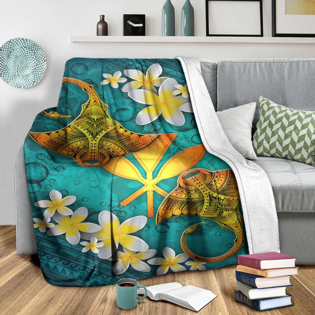Turquoise manta ray blanket with starfish accents and white plumeria flowers, plus white backing