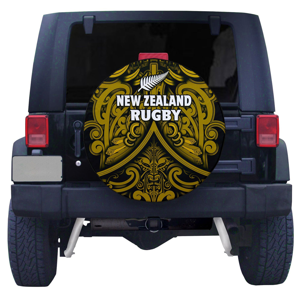 Black circular spare tire cover with gold Maori rugby emblem and silver fern detail