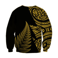 Unisex rugby sweatshirt, black with gold fern and Maori-style swirl panel on right side