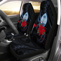 Black car seat covers with Polynesian floral print: blue leaf motifs and red hibiscus flowers.