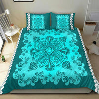 Turquoise bedding set featuring a large center mandala with scrolling floral details