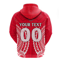 Red hoodie with 'YOUR TEXT' on chest and tribal white pattern, front close-up