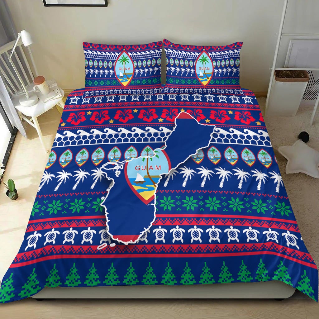 Blue Guam Christmas bedding set spread on bed, with map center, palms, and green tree band