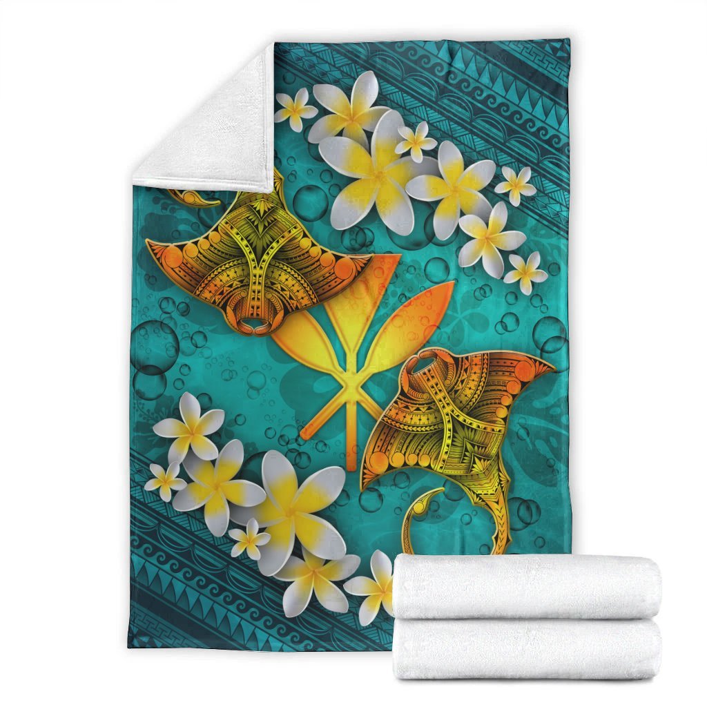 Turquoise manta ray blanket set with matching folded white towels on top and bottom