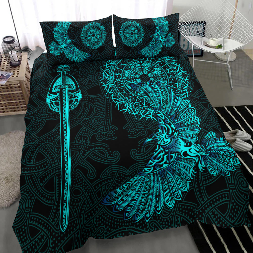 Black bedding set close-up: teal raven wing, sword graphic, and circular medallions
