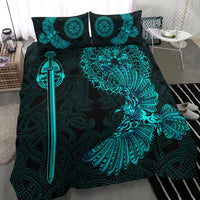 Black bedding set close-up: teal raven wing, sword graphic, and circular medallions