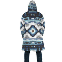 Back view of blue geometric AOP cloak with full hood and straight hem