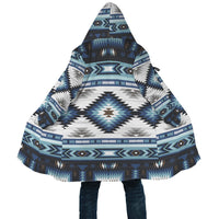 Front close-up: blue, white, and black geometric AOP cloak with hood and drawstring