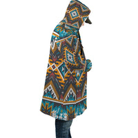 Hooded cloak in multicolor aztec geometric pattern, side view with draped back