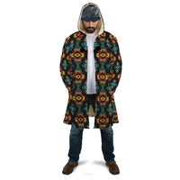 Unisex hooded cloak, dark base with red/yellow/teal geometric pattern, front opening