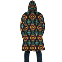 Unisex hooded cloak back view, bold southwestern geometric pattern on dark fabric