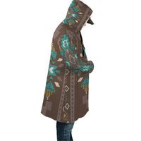 Hooded cloak in brown with multicolor geometric print panels, side view
