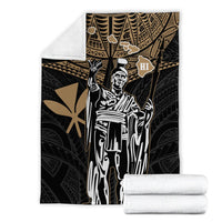Black and gold tribal Hawaii king blanket with white portrait, folded with white backing