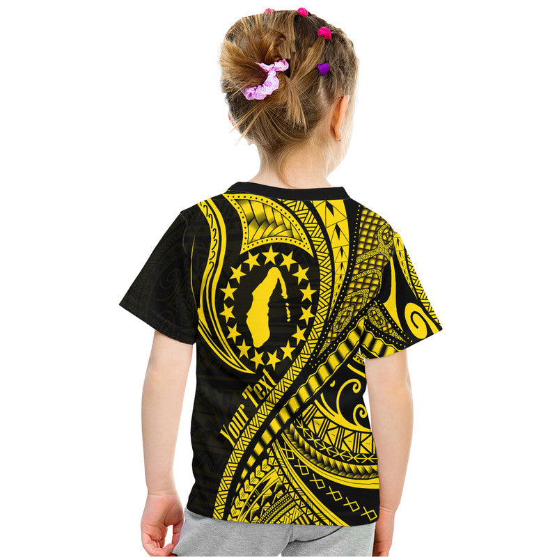 Youth T-shirt back view in gold and black with star badge and diagonal wave print