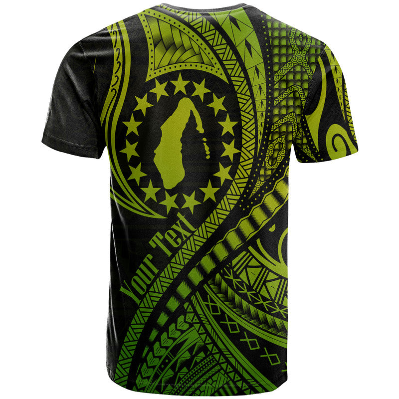 Green and black T-shirt with large circular emblem and detailed tribal wave print